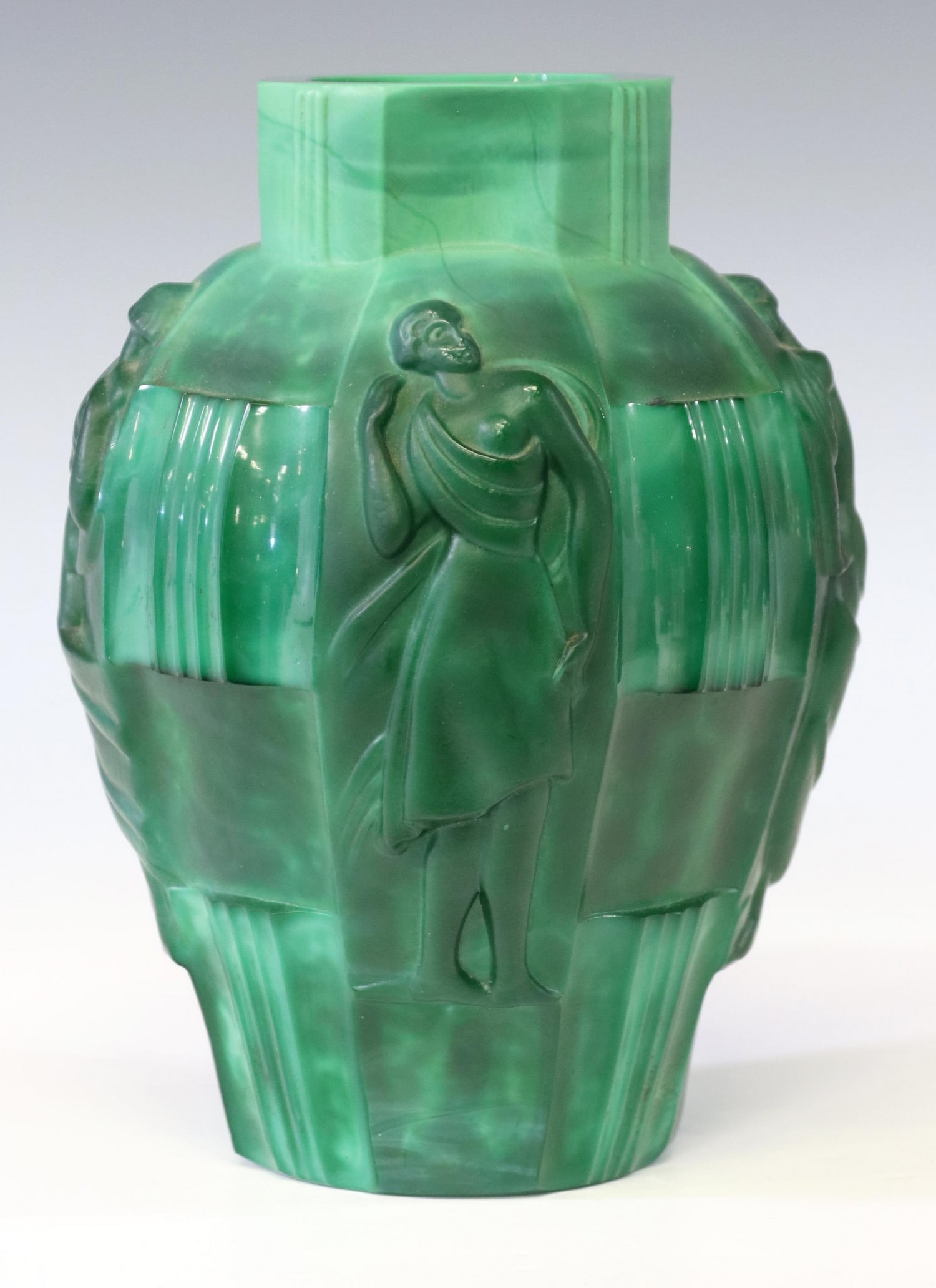 BOHEMIAN ART DECO MALACHITE-GREEN GLASS VASE: Bohemian Art Deco molded malachite-green glass vase, c.1930s, raised figures in draped gowns, flanked by ribbed panels, unmarked, approx 9.5"h, 6.75"diam, 4.25lbs Start Price: $100.00