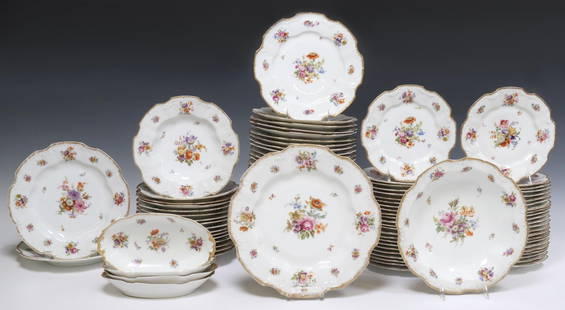 (118) FRENCH LIMOGES PORCELAIN DINNER SERVICE: (lot of 118) French Limoges porcelain partial dinner service, with transferred floral motifs similar to Dresden Flowers, parcel gilt trim, marked Limoges France underfoot, including: (34) dinner plate