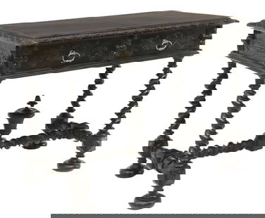 FRENCH LOUIS XIII STYLE EBONIZED WRITING TABLE: French Louis XIII style writing table, 19th c., in an ebonized finish, rectangular top with foliate and arched carved molded edge, two frieze drawers, twist legs joined by H stretcher, on bun feet, ap