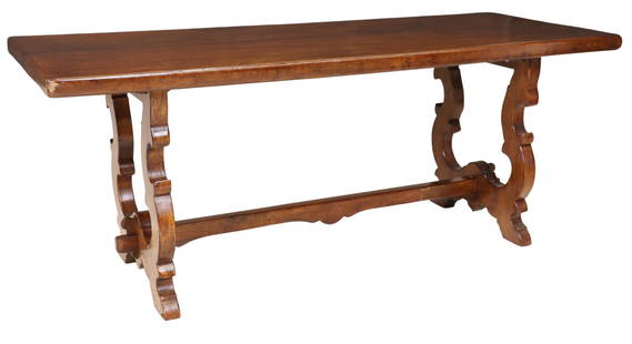 SPANISH BAROQUE STYLE WALNUT TRESTLE DINING TABLE: Spanish Baroque style walnut dining table, early 20th c., rectangular top, rising on scrolled trestle base, joined by H stretcher, approx 31"h, 79"w, 31"d, floor to apron: approx 28.5"h Start Price: $