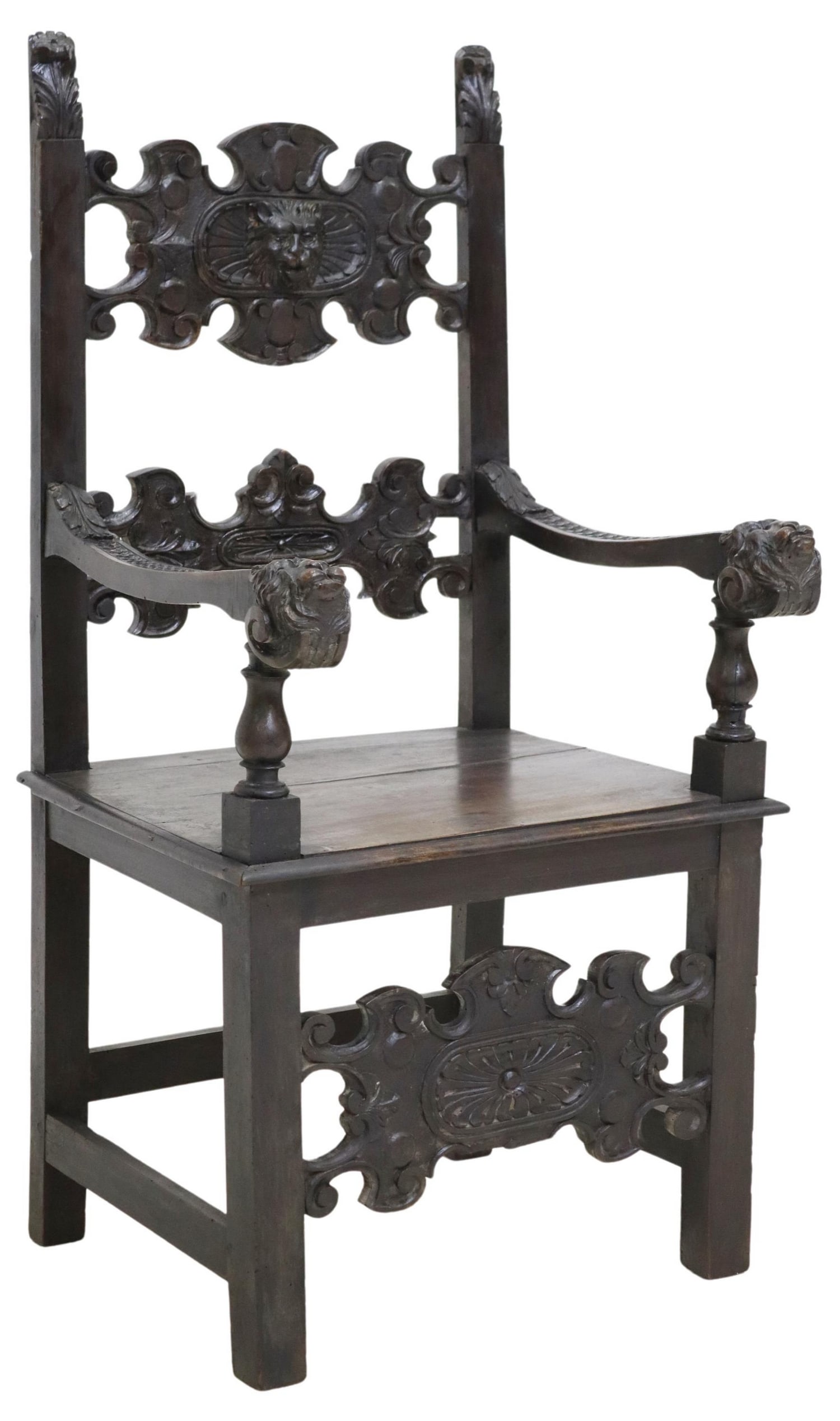 ITALIAN RENAISSANCE REVIVAL CARVED WALNUT ARMCHAIR: Italian Renaissance Revival carved walnut armchair, 19th c., top rail centered by a mask, lion-head arm terminals, plank seat, on stretcher-joined legs, approx 48"h, 24.25"w, 22.5"d, seat height: appr