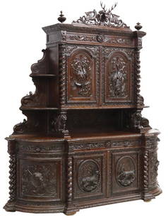 MONUMENTAL FRENCH CARVED OAK HUNT SIDEBOARD: French carved oak hunt sideboard, late 19th c., crest of a stag's head framed by winged griffins, two upper cabinet doors with fish, hare, game birds in relief, medial section supported by recumbent l