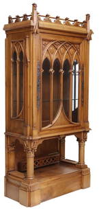 FRENCH GOTHIC REVIVAL VITRINE, SIGNED A. BASTET: French Gothic Revival walnut vitrine/ display cabinet, signed A. Bastet, Lyon, late 19th c., having carved tracery crown and overlay on glazed door with metal mounts, two interior glass shelves, over