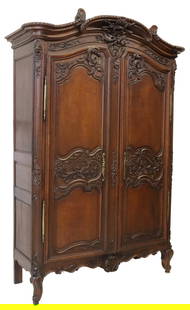 EXCEPTIONAL FINELY CARVED LOUIS XV ARMOIRE 19TH C.: French Louis XV style armoire, 19th c., having substantial foliate and bird carving, brass lock plates and brass hinges, a protruding cornice over two paneled doors, paneled sides, the interior now wi