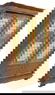 ITALIAN STAINED & LEADED GLASS BOOKCASE: Italian bookcase, late 19th c., molded cornice, two stained and leaded glass doors, painted panes depicting a farrier blacksmith and mason/ bricklayer, opening to adjustable-height shelves, on bun fee