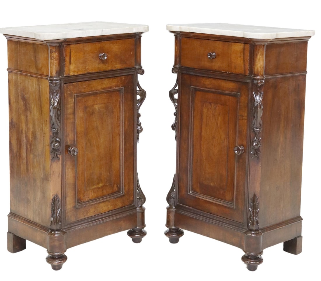 (2) ITALIAN MARBLE-TOP WALNUT BEDSIDE CABINETS: (pair) Italian marble-top walnut bedside cabinets, 19th c., having shaped top over single drawer, cabinet door, flanked by carved scrolled foliates and fruit motifs, ending on bun feet, approx 36.5"h,