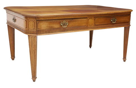 FRENCH WALNUT WRITING DESK OR LIBRARY TABLE: French walnut writing desk/ bureau plat, early 20th c., having rounded rectangular top, over two drawers, rising on fluted tapered supports, ending on squared feet, approx 31.5"h, 66.5"w, 42.25"d **No