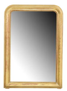 FRENCH LOUIS PHILIPPE PERIOD GILTWOOD WALL MIRROR: French Louis Philippe period giltwood wall mirror, mid 19th c., having arched frame with incised foliate motifs, beaded trim, encasing flat mirror plate, some minor silver loss to mirror plate, approx