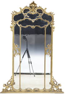 FRENCH LOUIS XV STYLE GILTWOOD OVERMANTEL MIRROR: French Louis XV style giltwood overmantel mirror, 20th c., having scrolled foliate crest, over shaped cushion frame, encasing flat mirror plate, some gilt painted touch ups, approx 69"h, 48.5"w,