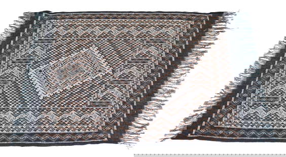 HAND-TIED AFRICAN RUG, 5'5.5" X 4'1": Hand-tied African rug, discoloration and loss to fringes, approx 5'5.5"w, 4'1"l Start Price: $80.00