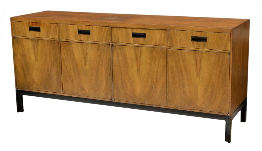 BAKER 1960'S SIDEBOARD CREDENZA: Baker oak finish sideboard or credenza c. 1960's, rectangular form with four short drawers over four doors, rising on black "L" shape legs, Baker tag at drawer interior, water stain on top, 30"h, 68"w