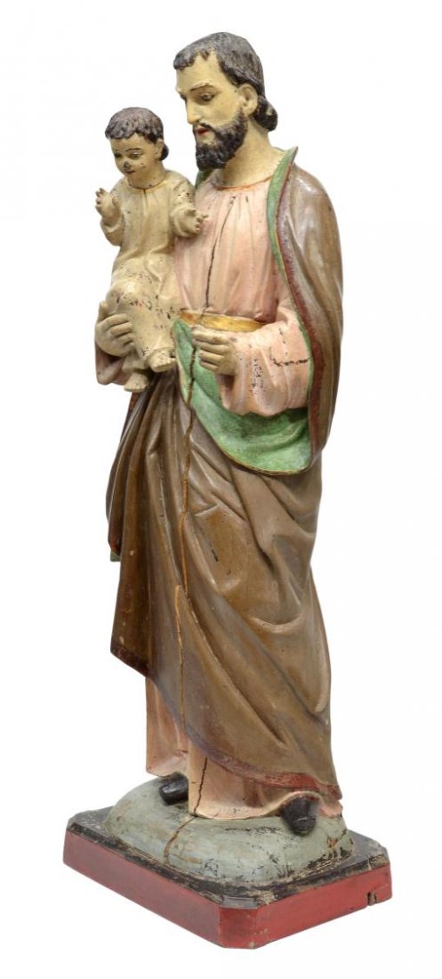 ANTIQUE RELIGIOUS FRENCH COLONIAL FIGURAL GROUP: Antique French Colonial carved wood religious figural group, 19th c., Joseph holding the Christ Child, glass faced eyes, draped in bronze tone, soft pink and green robes parcel gilded, rising on a sta