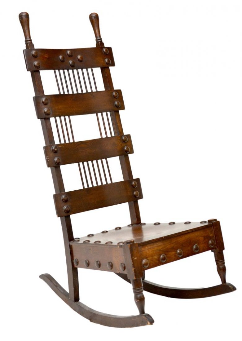 AMERICAN ARTS & CRAFTS OAK ROCKING CHAIR: American Arts & Crafts oak rocking chair, early 1900's, rabbit ear uprights, four back slats joined by vertical spindles, wood roundel accents, 49"h, 20"w, 33"d Start Price: $200.00