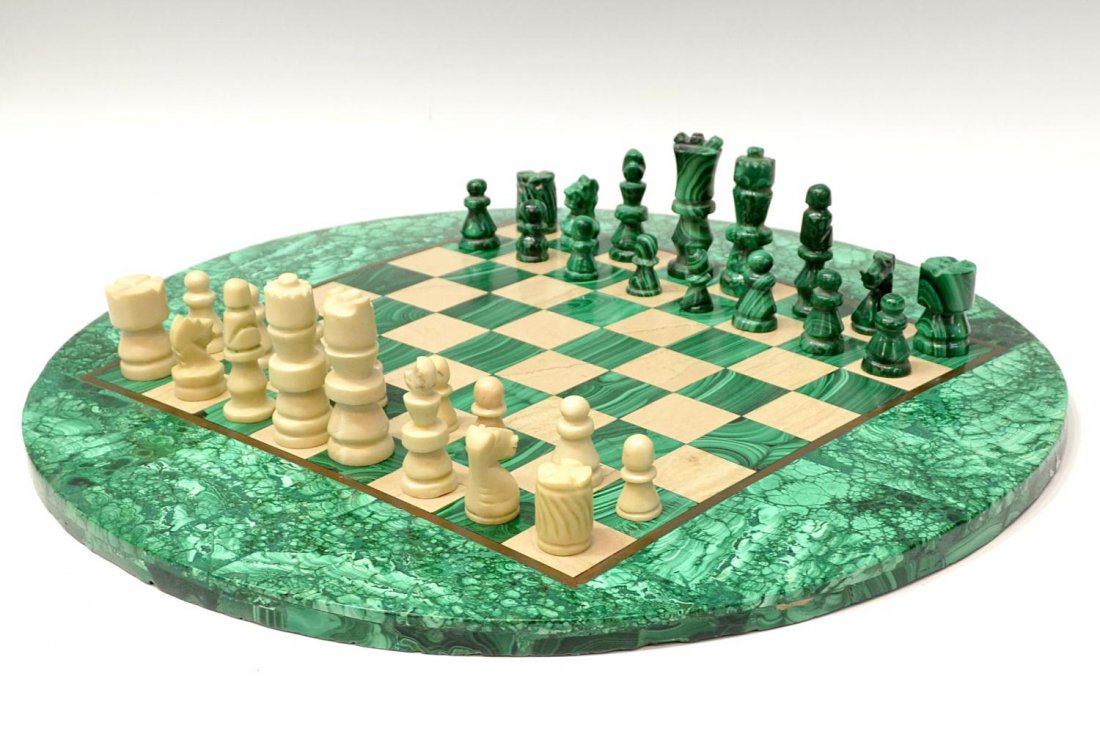 MALACHITE CHESS TABLE & PLAYING PIECES: Carved malachite and marble chess set, comprising of (32) carved playing pieces, together with matching malachite and marble circular chess board, some expected chipping and wear, largest: 3"h, smalle