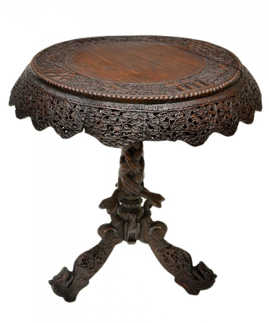 19TH C. PORTUGUESE COLONIAL ROSEWOOD TEA POY: Portuguese Colonial rosewood tea-poy or center table, early 19th c., the circular top bordered by densely leafy vines, architectural and scale motifs in relief, within a surround of beaded trim, above
