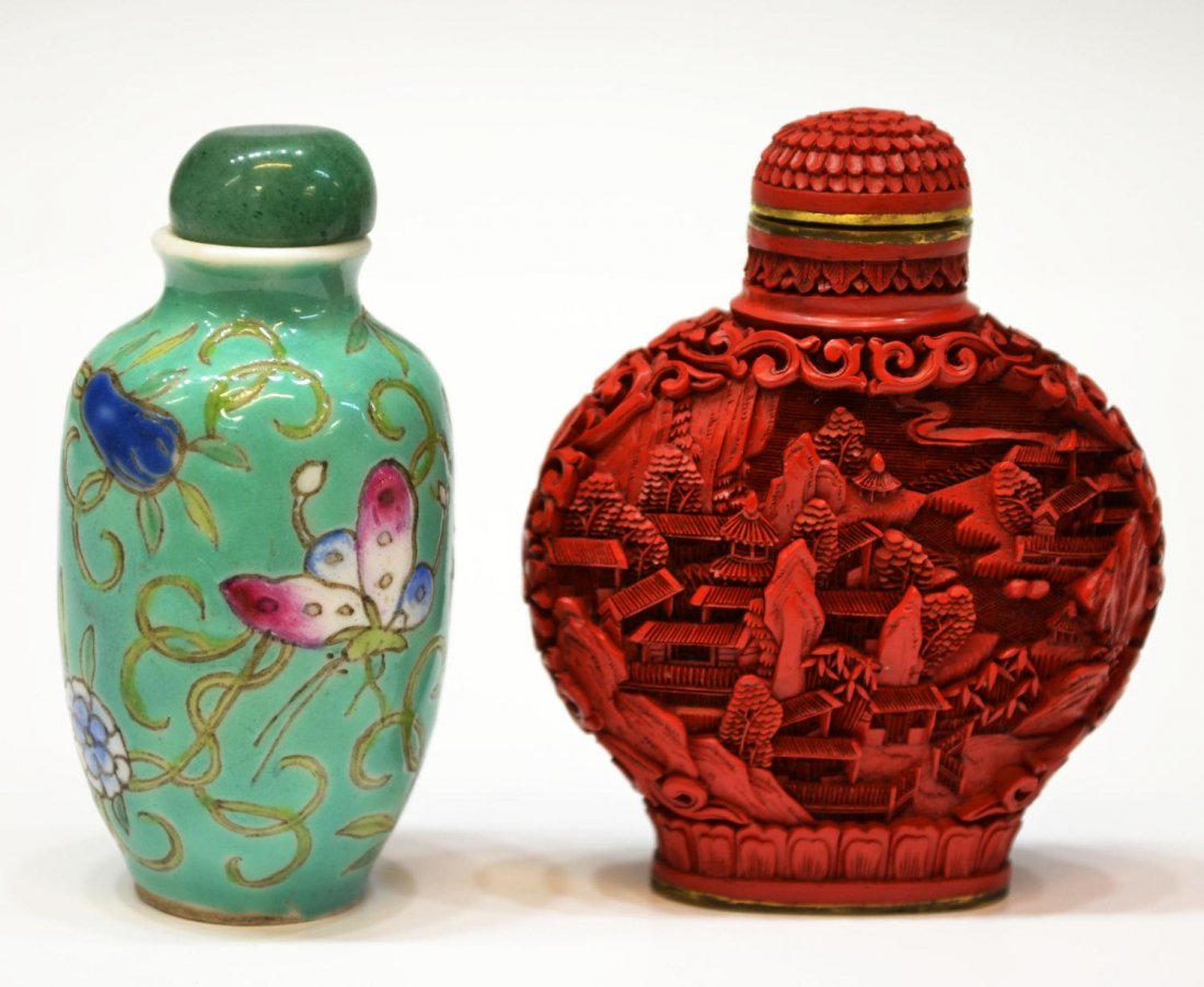 CHINESE CINNABAR & FAMILLE ROSE SNUFF BOTTLES: (lot of 2) Chinese snuff bottles, comprising: (1) carved cinnabar, 20th c., having architecture in relief, 2.5"h; (1) famille rose snuff bottle, butterflies among scrolling foliage, green stone lid, v