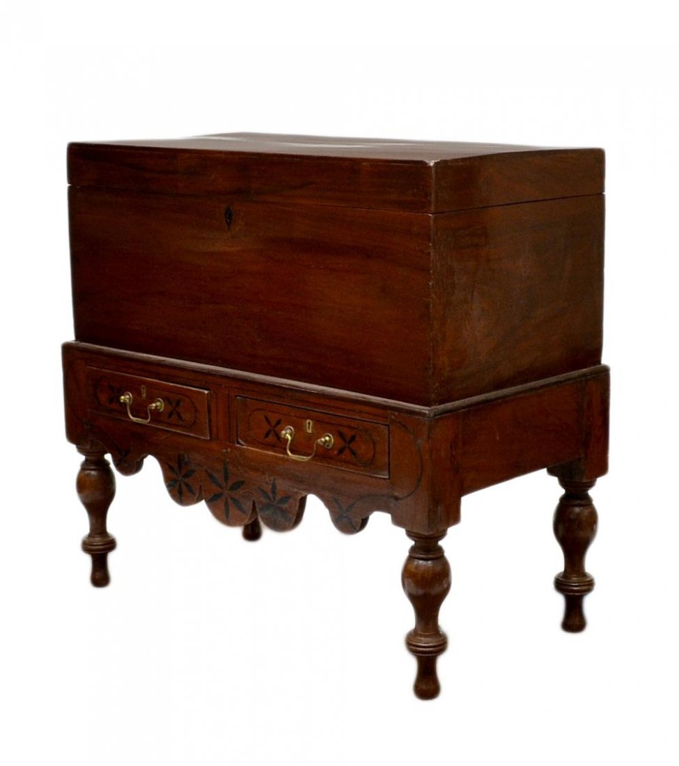 BRITISH COLONIAL INLAID STORAGE CHEST ON STAND: British Colonial storage chest with inlaid diamond form escutcheon, c. 1900, on a wood base with geometric inlay and a pair of aligned drawers, rising on turned supports, chest: 15.25"h, 35.75"w, 17.7