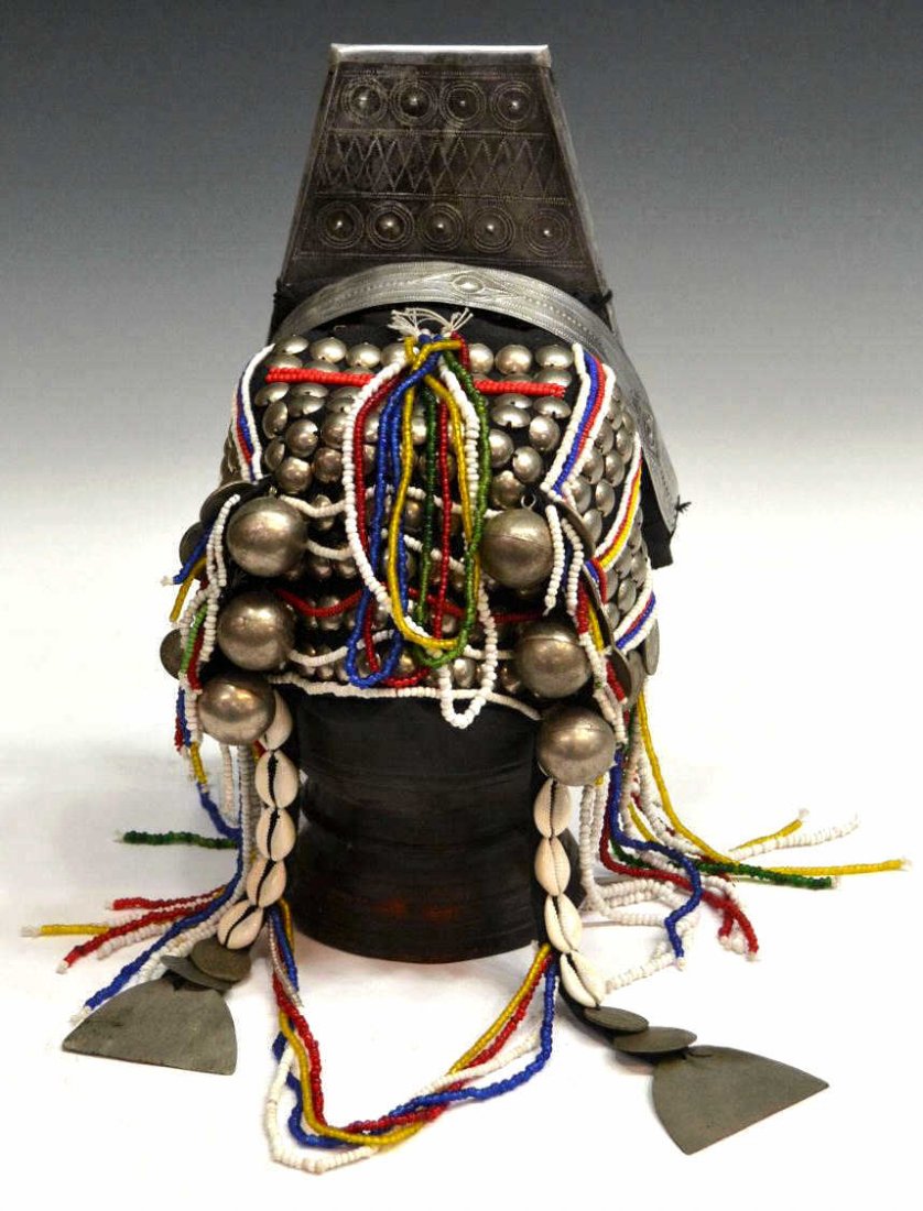 THAILAND AKHA HILL TRIBE TRADITIONAL HEADRESS: Thailand Akha Hill Tribe traditional headdress, material adorned with metal disks, balls, shells, coins and colorful beads, approx. 9.5"h, 8"l, 1lb total**wood stand not included** Start Price: $50.00