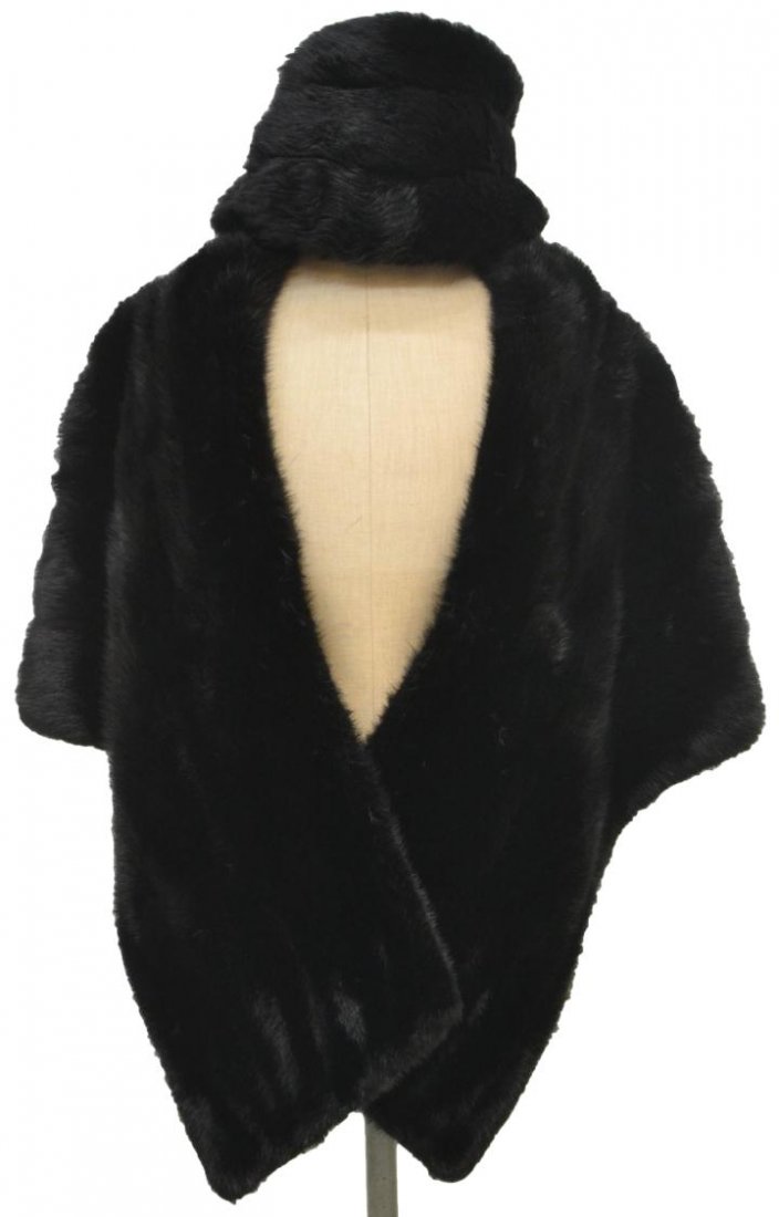 FINE VINTAGE LADIES MINK CAPE & FUR HAT: (lot of 2) A vintage ladies black mink stole, the fine collared wrap having lined interior, approx 20"w (shoulder), 26"l; together with a black fur hat; 2.25lbs total Start Price: $80.00