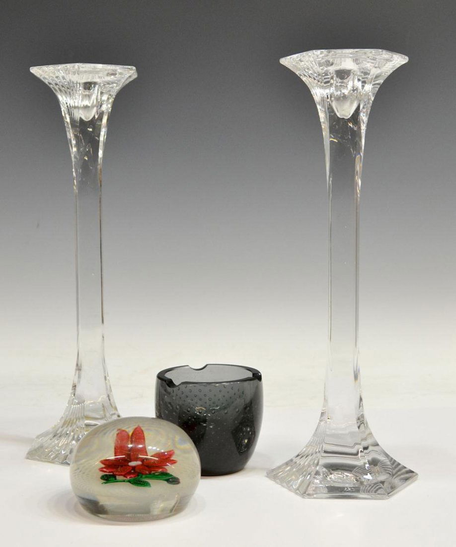 (4) ART GLASS PAPERWEIGHT, CANDLESTICKS & ASHTRAY: (lot of 4) Collection of art glass table items, comprising: (pair) Bleikristall colorless candlesticks, West Germany, flared hexagonal at top and bottom with a rectangular body, 12.75"h; (1) gray art