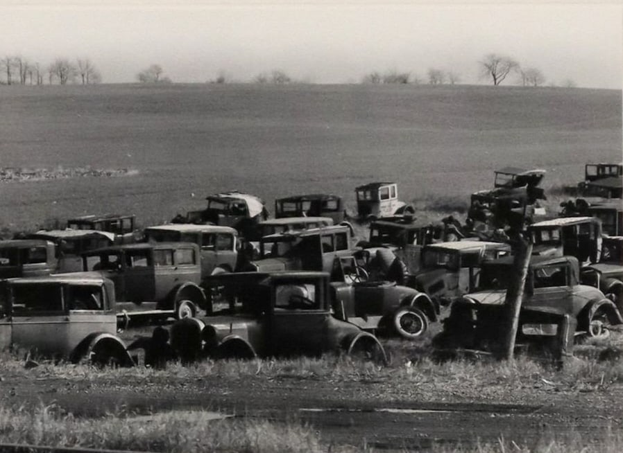 WALKER EVANS (D.1975) JOE'S AUTO GRAVEYARD, 1971: Framed gelatin silver print, Joe's Auto Graveyard, Near Bethlehem, Pennsylvania, negative 1936, printed 1971, signed in pencil to the mount at lower right Walker Evans (American, 1903-1975), plate IV,