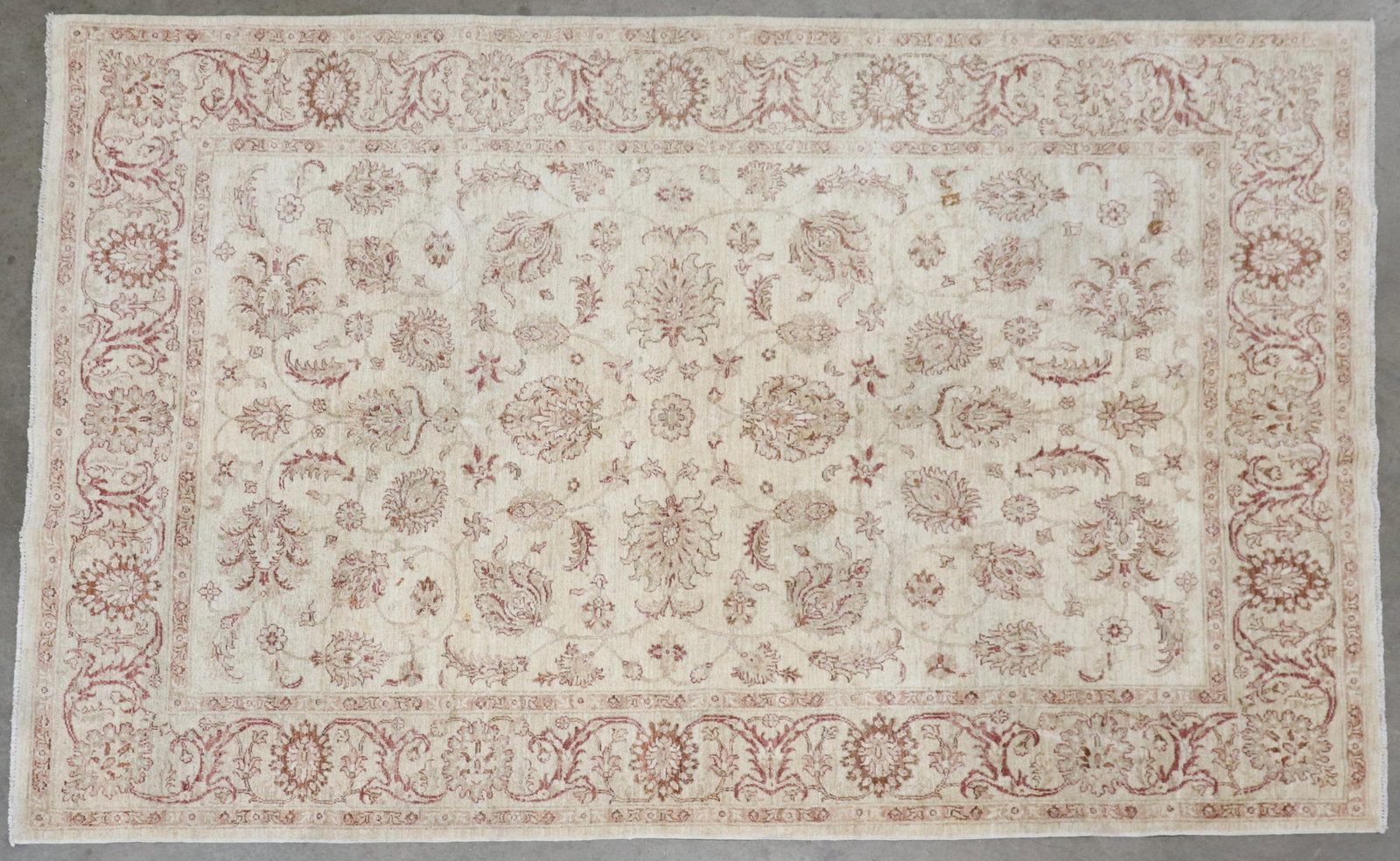 HAND-TIED GHAZNI RUG, PAKISTAN, 9'9" X 6'6": Hand-tied Ghazni rug, Pakistan, some spotting, approx 9'9"l, 6'6"w **Please Note: All of the rugs offered in this auction would likely benefit from a professional cleaning. Estate rugs may show some w