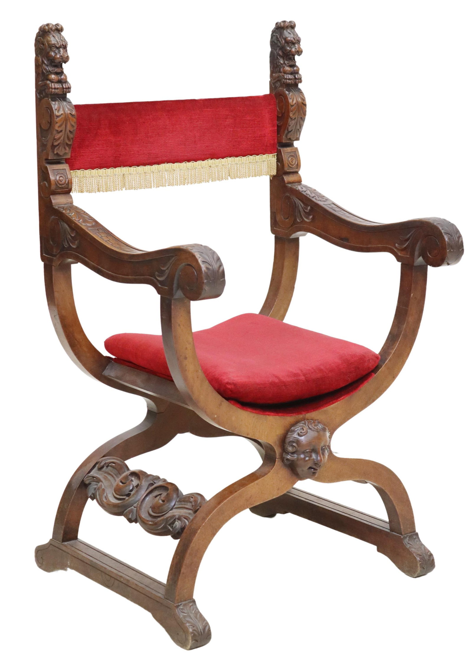 ITALIAN RENAISSANCE REVIVAL SAVONAROLA CHAIR: Italian Renaissance Revival walnut Savonarola chair, late 19th c., carved lion finials to the uprights, padded narrow back and loose cushion, arms terminating in an acanthus scroll, x-form base with c