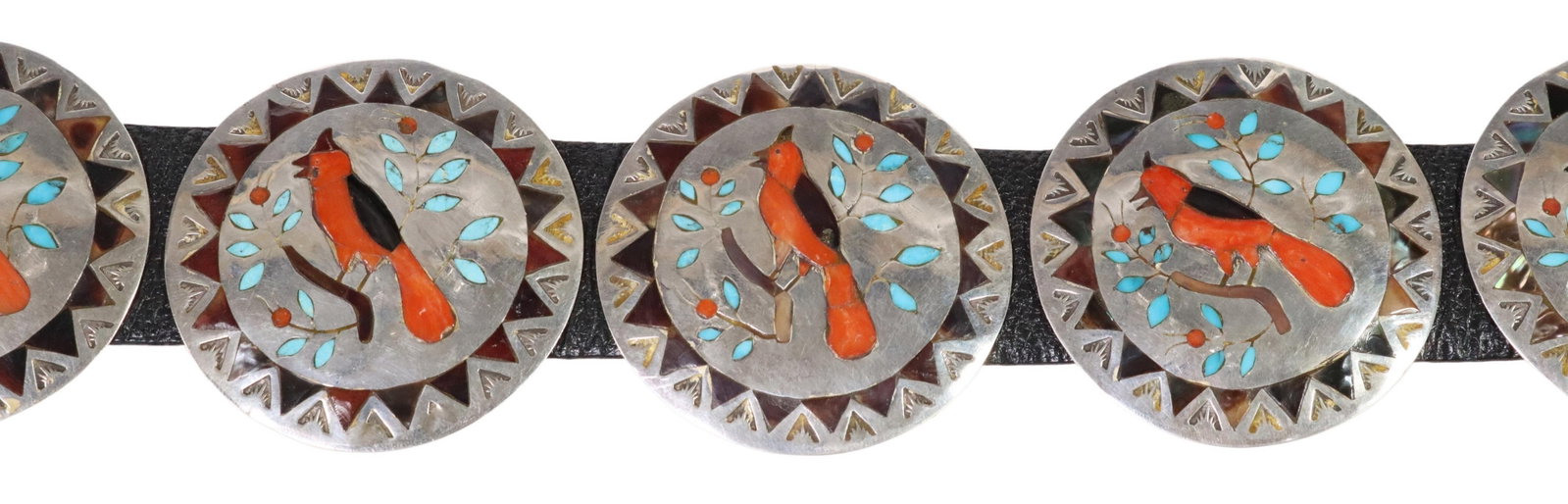 SIGNED RB NAVAJO SILVER CARDINAL CONCHO BELT: Native American silver (content unknown) concho belt, stamped RB, Navajo, circular buckle and eight matched conchos, each inlaid with red coral, shell and turquoise, depicting a cardinal perched on a 