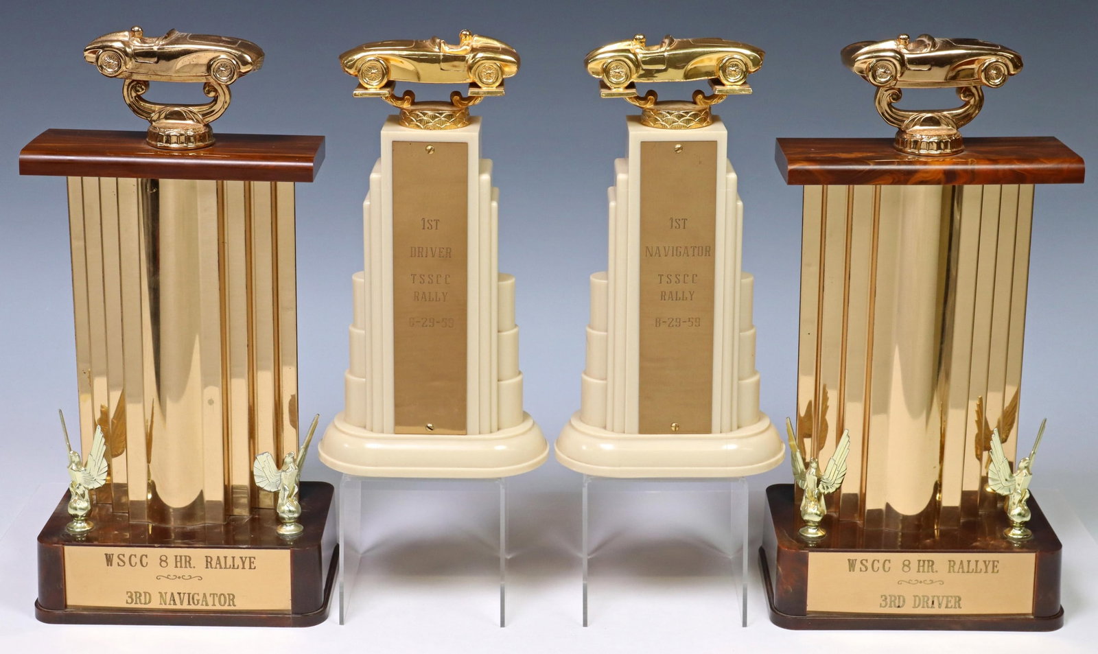 4) VINTAGE 1959 & OTHER AUTOMOBILE RACING TROPHIES: (lot of 4) Vintage American automobile racing trophies, both sets engraved plaques devoting one trophy to driver, the other to navigator, including: (2) WSCC 8-Hour Rally Third Navigator, stepped plas