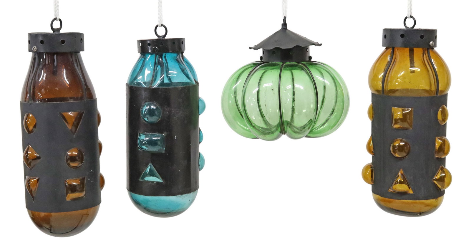 (4) IRON & COLORED GLASS LANTERNS, MEXICO: (lot of 4) Iron and hand blown colored glass lanterns, Mexico, each with attached hanging material, including: (3) shaped with geometric patterns, approx 18 7/8"h, 6.75"diam; (1) Calabaza shape, appro