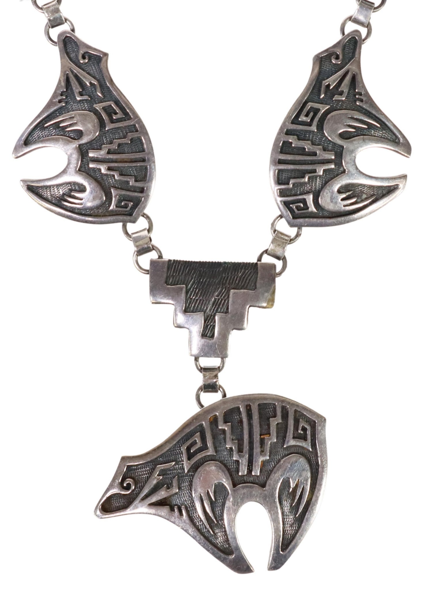 SOUTHWEST STERLING SILVER OVERLAY BEAR NECKLACE: Southwest sterling silver overlay necklace, central drop bear pendant, various figural bear, thunderbird, serpent links, ending in chain with hook clasp, stamped sterling on central link holding drop,