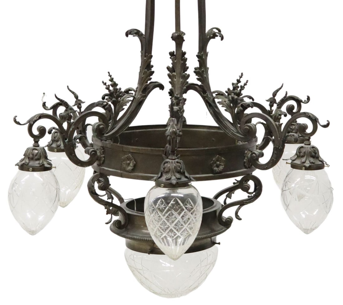 LARGE ITALIAN PATINATED METAL 7-LIGHT CHANDELIER: Large Italian patinated metal seven-light chandelier, early 20th c., having six straight supports extending from foliated scrolls, issuing six scrolls arms with removable colorless glass shades, all o
