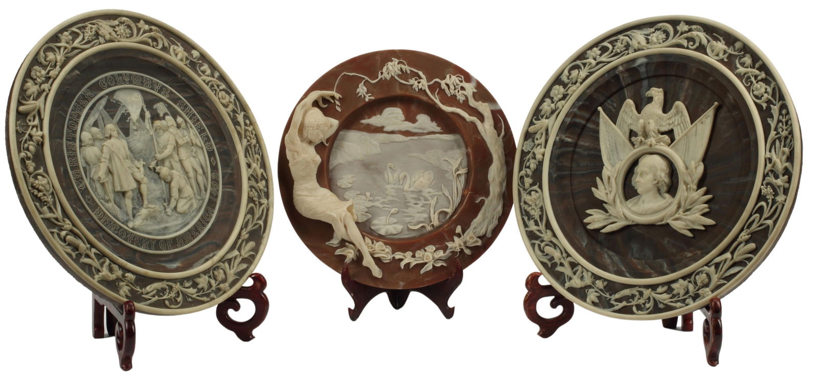(3) GROUP OF RELIEF PLAQUES/ CHARGERS: (lot of 3) Limited-edition marbelized relief plaques, Incolay Studios Incorporated, various scenes, including: (2) "Columbus: Quincentennial of America, 1492-1992," numbered 2, (one) intact with glue