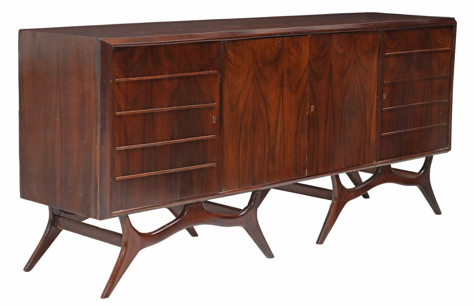MID-CENTURY MODERN ROSEWOOD SIDEBOARD: Mid-century modern rosewood sideboard, c.1960s, rectangular case fitted with four cabinet doors, central doors revealing shelved interior, flanked on both sides by two interior drawers, rising on scul