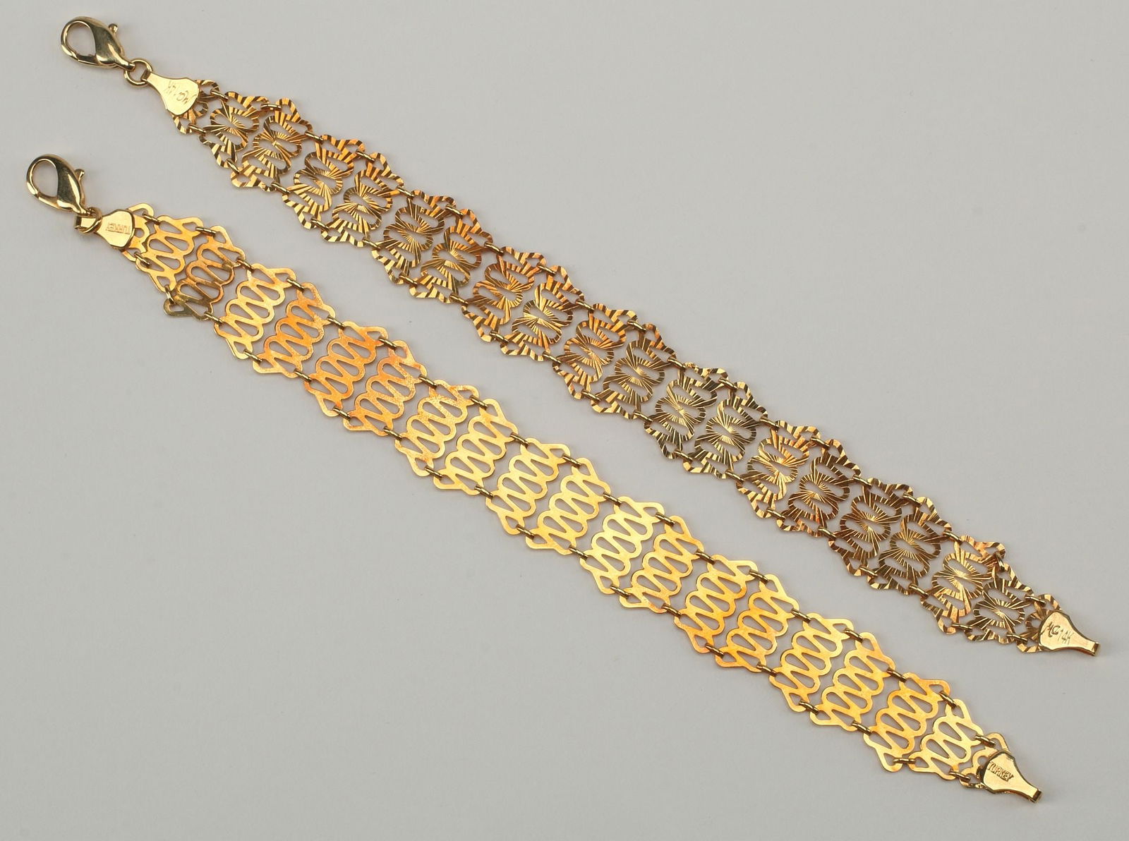 (2) ESTATE 14KT YELLOW GOLD DELICATE LINK BRACELETS: (lot of 2) Estate 14k yellow gold link bracelets, delicate openwork links, lobster claw clasp, marked MA 14K Turkey, approx 6 7/8"l; 11.3 grams total **Provenance: From a fine Louisiana esta