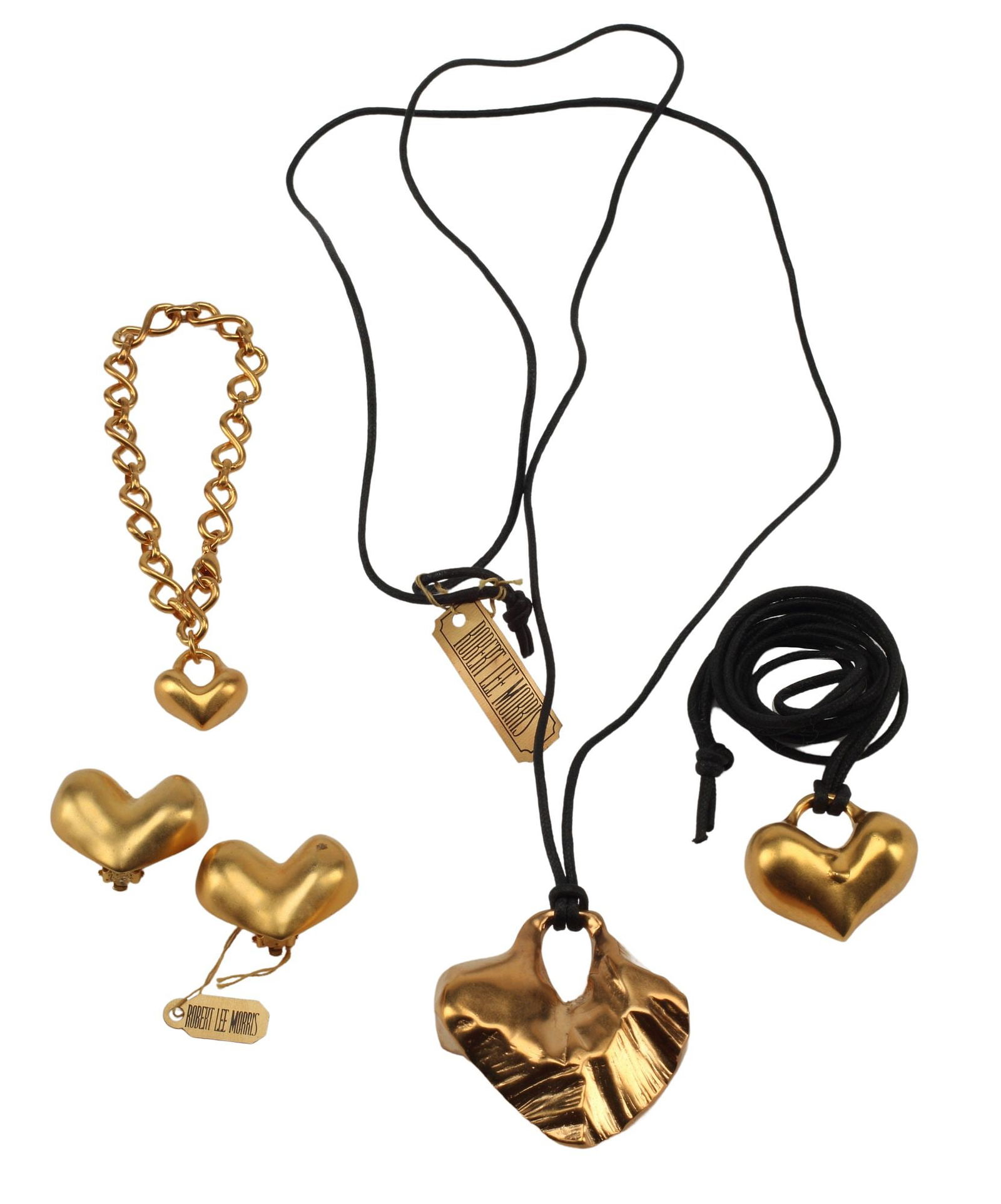 (4) DESIGNER ROBERT LEE MORRIS GOLD-PLATED BRASS HEART-SHAPED JEWELRY: (lot of 4) Estate designer gold-plated brass heart-shaped jewelry, Robert Lee Morris (American, b.1947), including: (1) charm bracelet, approx 8"l, (pair) clip-on earrings, approx 1 1/8"