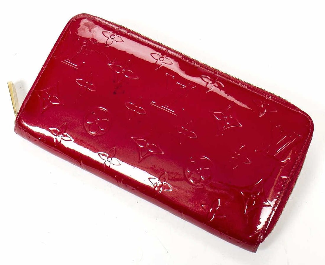 LOUIS VUITTON 'ZIPPY' POMME D'AMOUR VERNIS WALLET: Louis Vuitton "Zippy" wallet, in Pomme D'Amour Vernis leather, with brass hardware, tonal leather lining, interior bill and zipper compartments, eight card slots, zip-around closure, ret