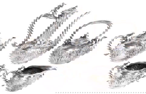(5) FINE JAPANESE KONOIKE SILVER DRAGON & IRISES TEA & COFFEE SERVICE: (5 piece) Japanese silver tea and coffee service, Konoike (fl.1880-1921), Yokohama, with cast dragon-form handles, bodies decorated with repousse irises, signed Konoike and marked underfoot with "jung