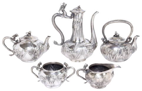 (5) FINE JAPANESE KONOIKE SILVER DRAGON & IRISES TEA & COFFEE SERVICE: (5 piece) Japanese silver tea and coffee service, Konoike (fl.1880-1921), Yokohama, with cast dragon-form handles, bodies decorated with repousse irises, signed Konoike and marked underfoot with "jung