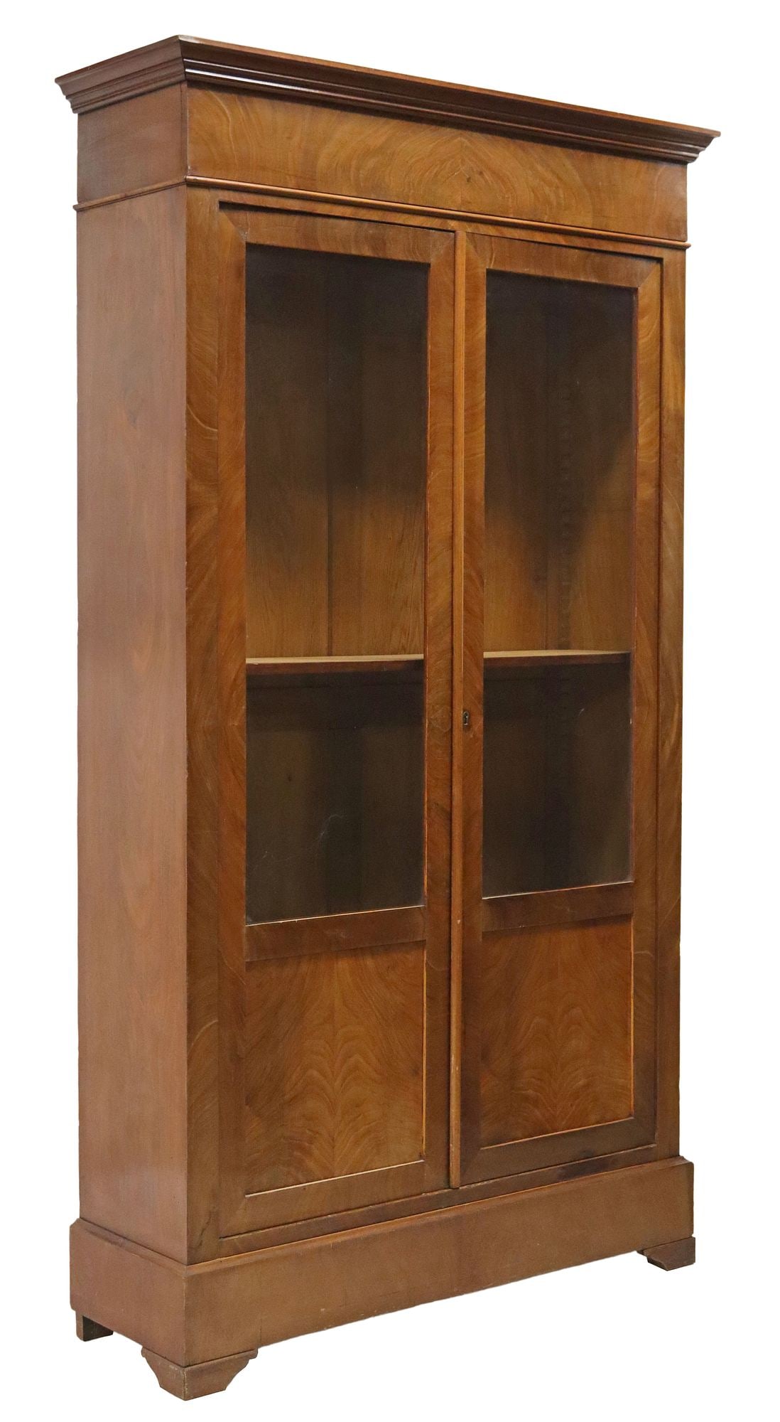 FRENCH LOUIS PHILIPPE PERIOD MAHOGANY BOOKCASE: French Louis Philippe period mahogany bookcase, mid 19th c., molded cornice, above a pair of glazed and paneled doors, on bracket feet, approx 80"h, 45"w, 14.5"d