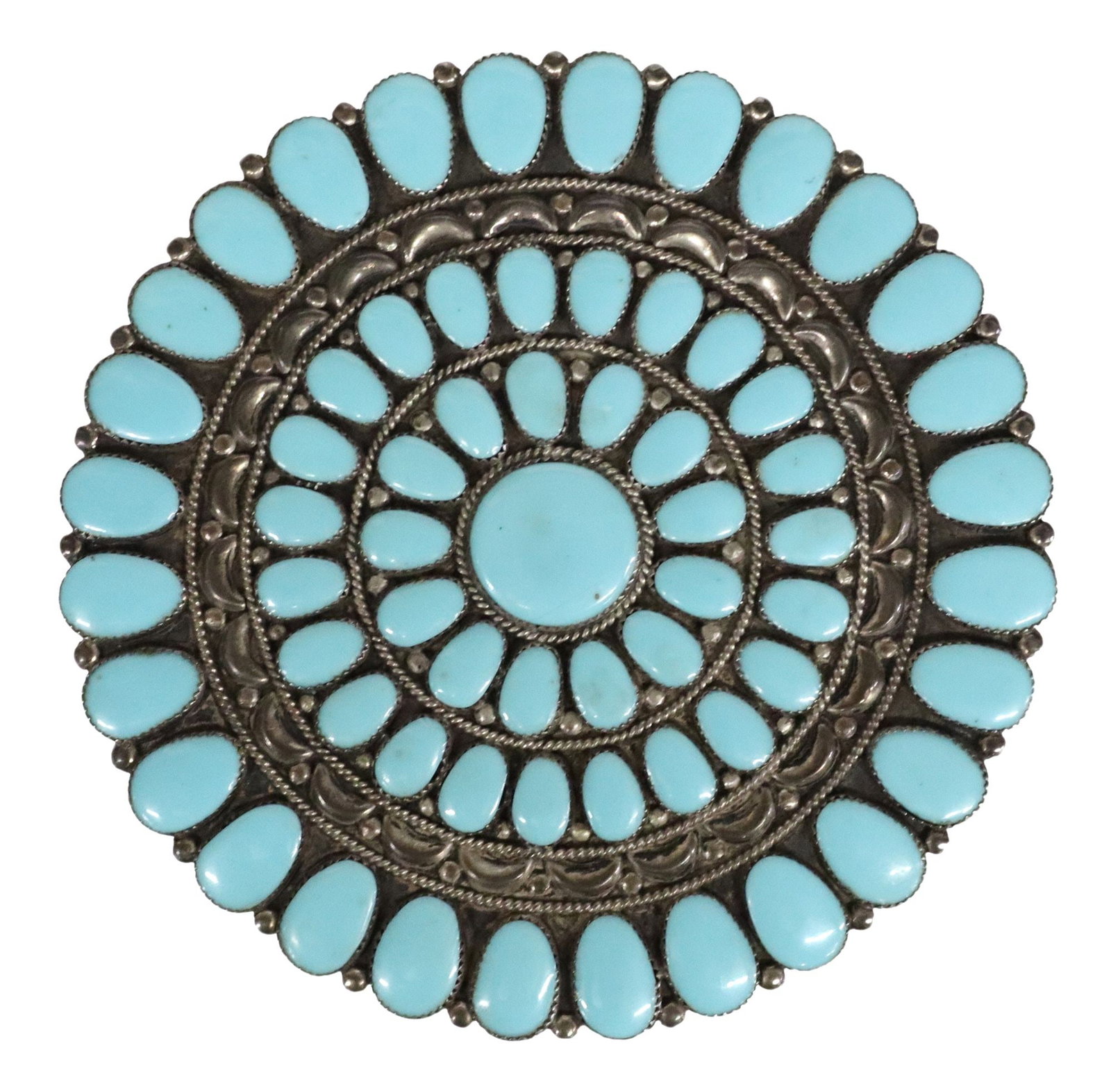 LARGE NATIVE AMERICAN SILVER CLUSTER BELT BUCKLE, 5"DIAM: Large Native American silver (content unknown) belt buckle, incised initials JW, radiating clusters of bezel-set turquoise-color stones, likely block, approx 5"diam, 108.7 grams (inclusive of all