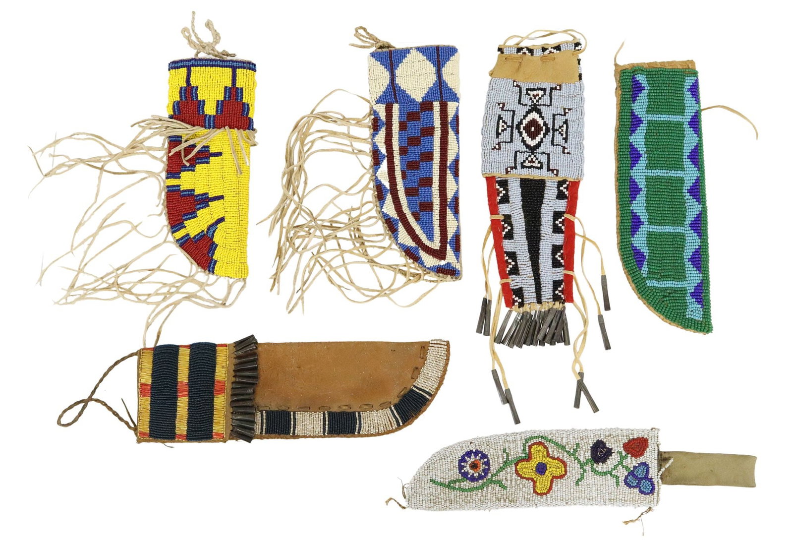(6) BEADED NATIVE AMERICAN KNIFE SHEATHS: (lot of 6) Beaded Native American knife sheaths, 20th c., acquired from the Oglala Lakota Sioux Reservation, Pine Ridge, South Dakota, multi color and varied patterns, two with jingle cones, for shipp