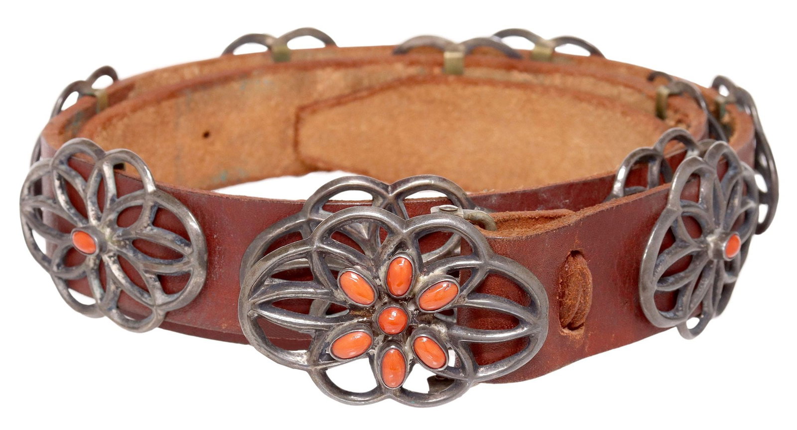 NATIVE AMERICAN SILVER & RED CORAL CONCHO BELT: Native American tufa cast silver (content unknown) concho belt, unmarked, (one) oval buckle with seven red coral cabochons, and (nine) matched conchos, each centering red coral cabochon, on