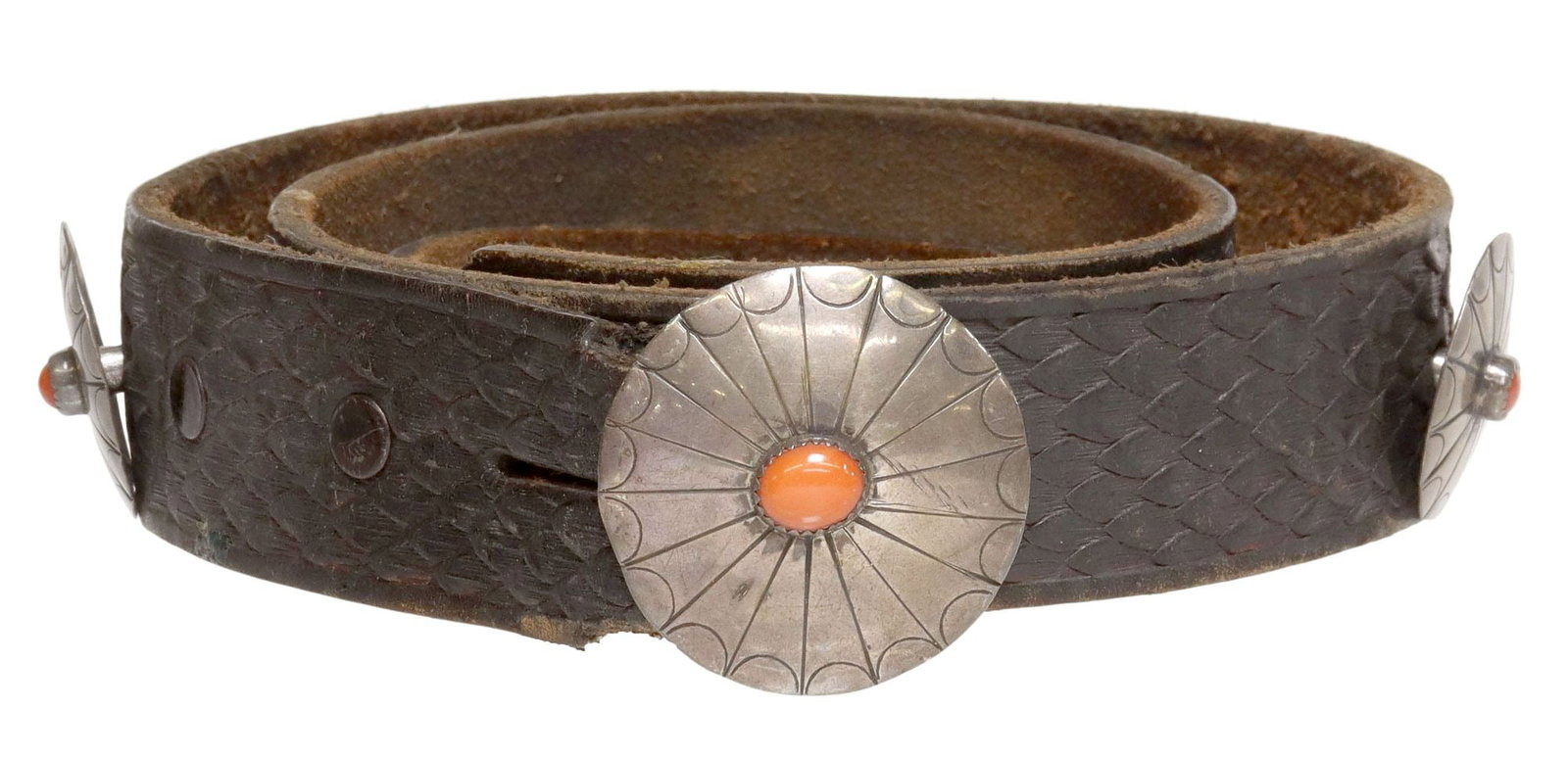 NATIVE AMERICAN SILVER & RED CORAL CONCHO BELT: Native American silver (content unknown) concho belt, unmarked, (one) oval buckle, (nine) matched conchos, each centering a small red coral cabochon, on a textured leather belt, buckle: approx 1 5/8&q