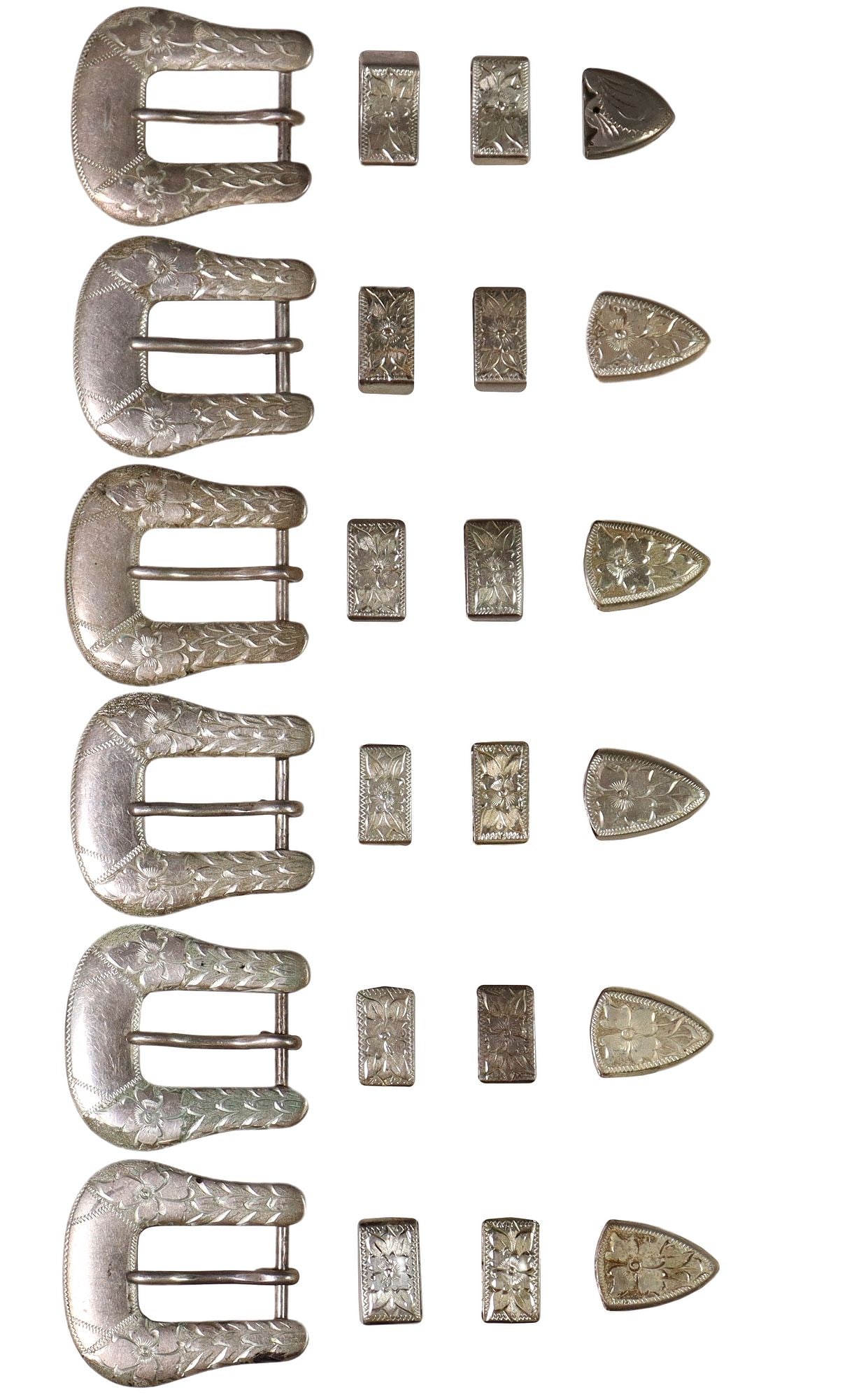 (6) WESTERN COWBOY STERLING RANGER BUCKLE SETS: (lot of 6) Western sterling silver ranger belt buckle sets, matched engraved floral motifs, each with (one) buckle, 1.75"l, 1.5"w, (two) keepers, and (one) tip, buckles only hallma