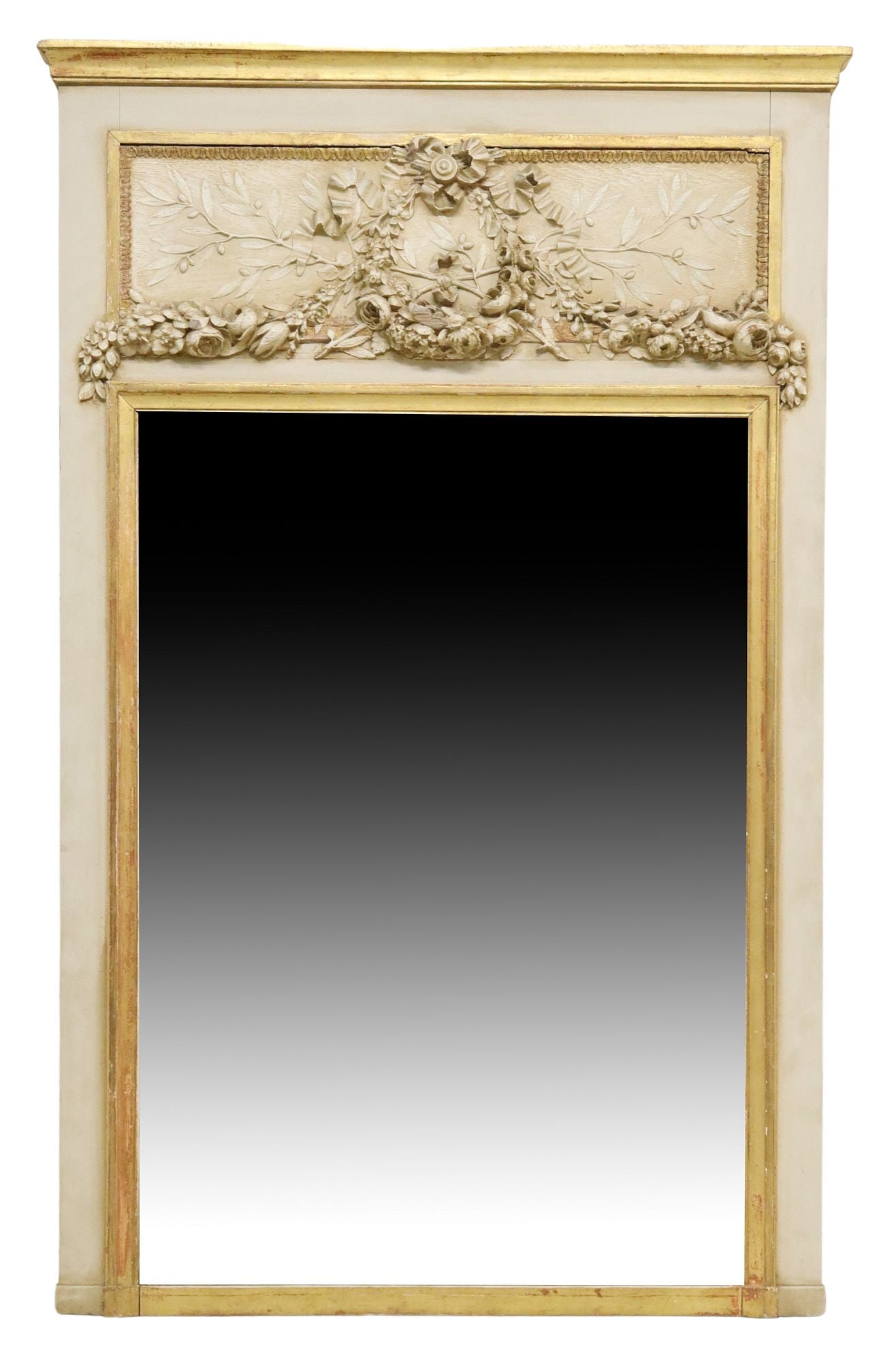 FRENCH LOUIS XVI STYLE PARCEL GILT TRUMEAU MIRROR: French Louis XVI style parcel gilt trumeau mirror, 20th c., having carved panel with floral swag and ribbon trim, over white painted and giltwood frame, encasing flat mirror plate, approx 65 1/8&