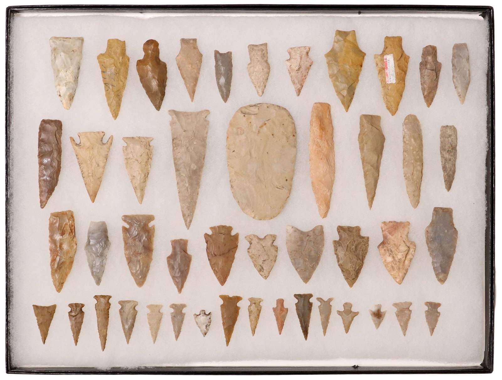 (46) TEXAS ARROWHEADS: (lot of 46) Texas arrowheads, bird points, scraper marked Guadalupe River (Central Texas),a spear point approx. 4"l, all housed in a Riker box approx. 1" x 16.25" x 12.25&quo