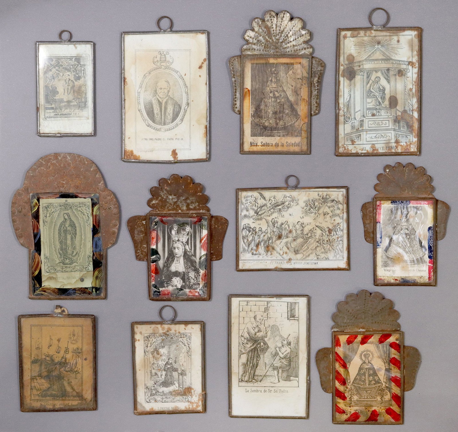 (12) FRAMED RELIGIOUS RETABLO PRINTS, MEXICO: (lot of 12) Framed retablo prints, Mexico, each housed in an embossed metal nicho/frame, highlights include: (2) San Pascual Bailon (St. Paschal Baylon), (4) Nuestra Senora de la Soledad (Oaxaca, Juqu