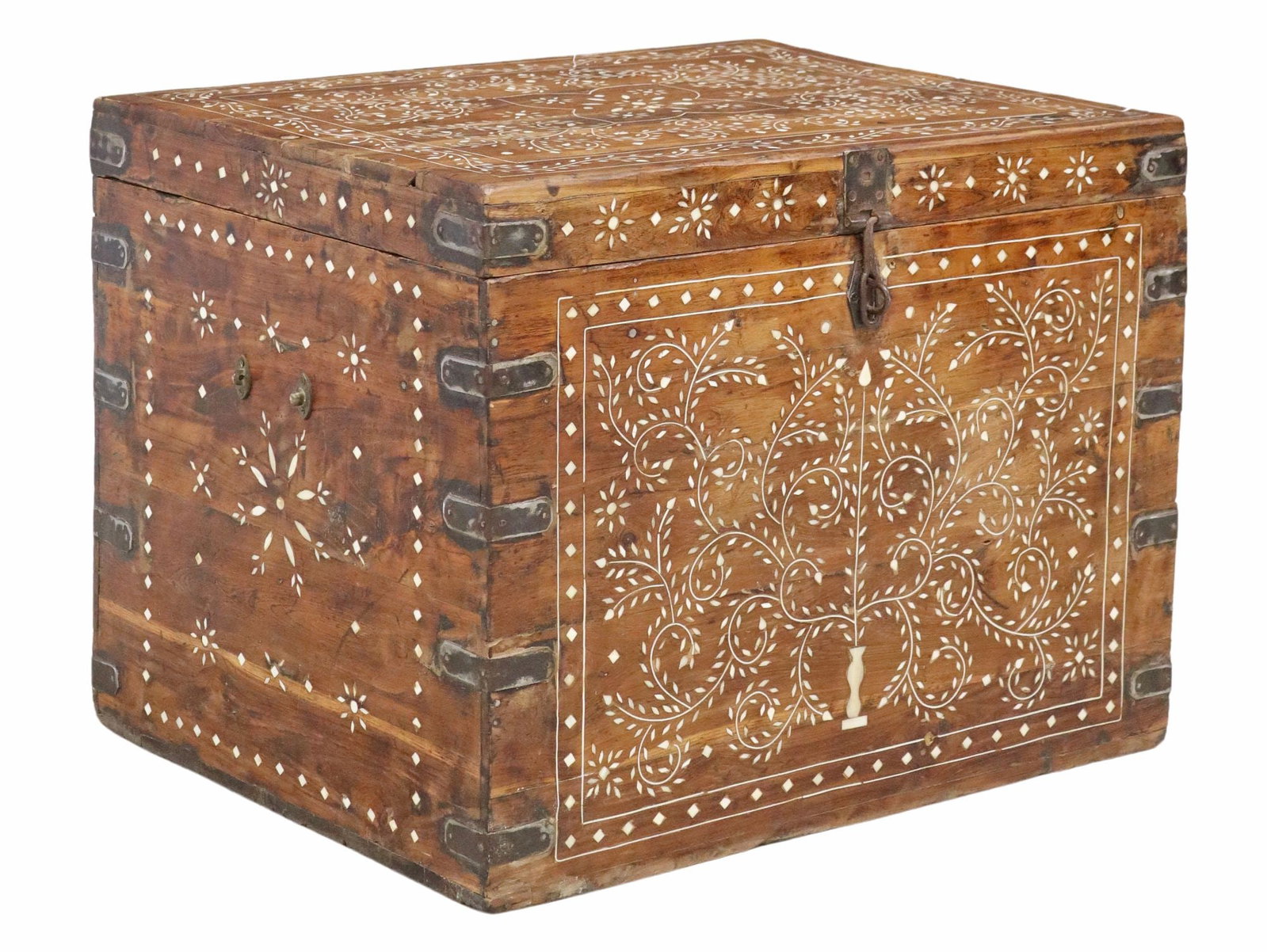 FOLIATE INLAID WOOD STORAGE CHEST, INDIA: Inlaid iron-bound wood storage chest, India, having hinged top, revealing narrow interior compartment and concealed lower storage, with arabesque scrolling foliate and geometric inlay, loss