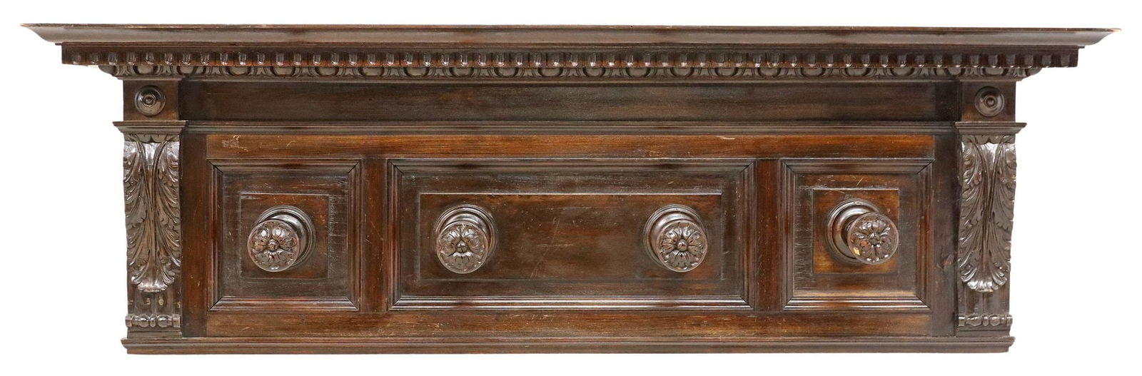 LARGE RENAISSANCE REVIVAL WALL-MOUNTED HAT / COAT RACK: Large Italian Renaissance Revival carved walnut wall-mounted hat/ coat rack, early 20th c., having stepped cornice shelf, over four turned hat/ coat hooks, carved with foliate and floral motifs, 